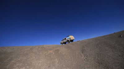 Dakar Rally director Etienne Lavigne, and staff members drive in Iquique on Saturday in Chile during the reconnaissance for the next Dakar 2015 that will kick off on January 4 in Buenos Aires, Argentina and will run untill January 17, after 9,000 kilometres through Argentina, Bolivia and Chile. Franck Fife / AFP / September 20, 2014