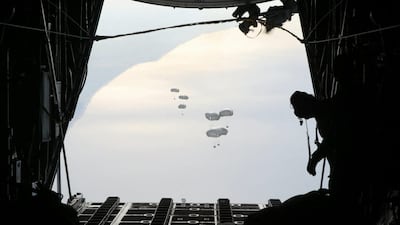 A Jordanian military aircraft dropping relief goods over the southern Gaza Strip. AFP