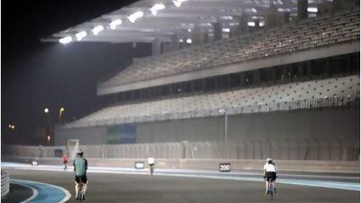 Away from the traffic on the capital's streets, cyclists take part in an open cycle night at Abu Dhabi's Yas Marina Circuit.