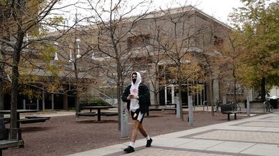 A student wearing a protective mask walks on the campus of the University of Wisconsin-Madison, as the coronavirus outbreak continues in Madison, Wisconsin, US. Reuters