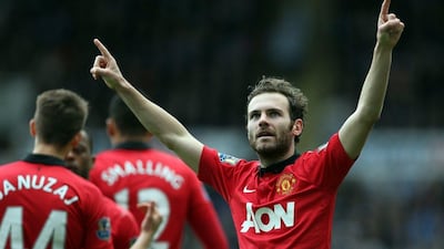 Manchester United midfielder Juan Mata celebrates scoring his second goal against Stoke City on Saturday, Ian MacNicol / AFP / April 5, 2014