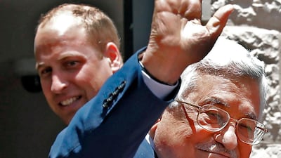 Palestinian president Mahmud Abbas gestures as he receives Britain's Prince William in the West Bank city of Ramallah. Ahmad Gharabli / AFP