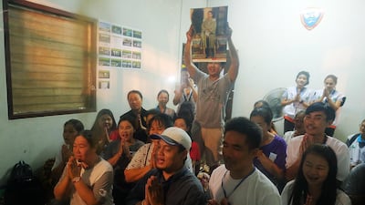 Relatives of the missing boys pray for them after the 12 boys and their soccer coach have been found alive in the cave where they've been missing for over a week after monsoon rains blocked the main entrance in Chiang Rai, Thailand, on July 02, 2018. Linh Pham / Getty Images