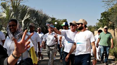 Walkers included zoo staff, families, tourists and a group of about 25 students and administrators from Future International Academy. Christopher Pike / The National