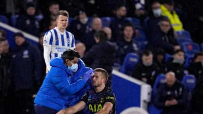 Tottenham's Eric Dier receives treatment for a head injury. AP