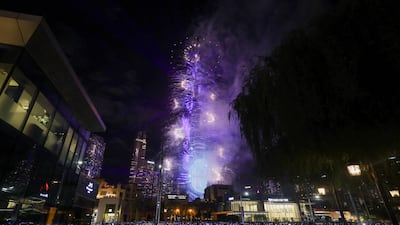 Crowds gather near the Burj Khalifa during New Year's celebrations in Dubai. Reuters