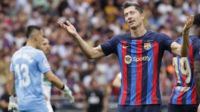 Robert Lewandowski celebrates after scoring his second. EPA