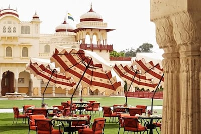 Verandah Cafe serves traditional afternoon tea amid the Mughal Gardens. Photo: Rambagh Palace