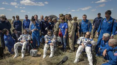 Tim Peake (seated L) of the European Space Agency, Yuri Malenchenko (seated C) of Roscosmos, and Tim Kopra (seated R) of Nasa sitting in chairs outside the Soyuz TMA-19M spacecraft just minutes after they landed in a remote area near the town of Zhezkazgan, Kazakhstan, 18 June 2016. EPA/BILL INGALLS/NASA