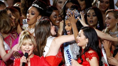 Singer LuLu performs as Miss World 2019 Toni Ann Singh of Jamaica celebrates. REUTERS