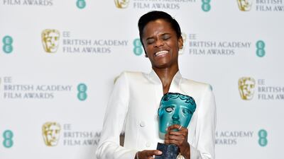 Letitia Wright poses with her Rising Star award in the press room during the Baftas. EPA