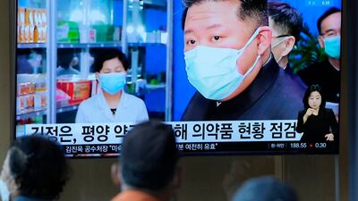 People at a train station in Seoul, South Korea, watch a news programme showing North Korean leader Kim Jong Un on May 16. AP