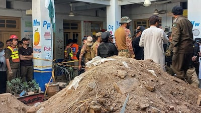 Rescue teams at the scene at Al Khair Education Centre. Reuters