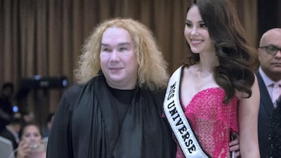 Catriona Gray with Filipino designer Furne One of Amato Couture at awards. Photo: Leslie Pableo / The National