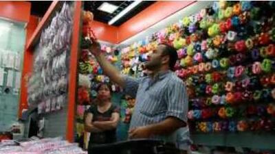 A Middle Eastern trader examines goods in Yiwu's vast Futian Market.