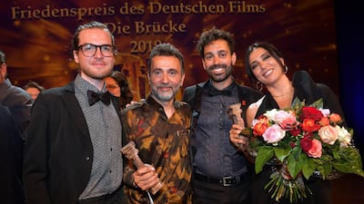 'Capernaum' editor Konstantin Bock, Talal Derki, 'Capernaum' cinematographer Christopher Aoun and Nadine Labaki at the Bernhard Wicki Award. Photo by Hannes Magerstaedt/Getty Images.