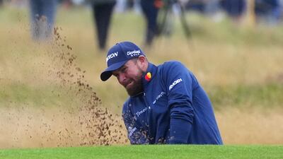 Ireland's Shane Lowry chips out of a bunker on the 16th on his way to a five-under-par first round of 66 in The Open at Royal Troon on Thursday, July 18, 2024. PA