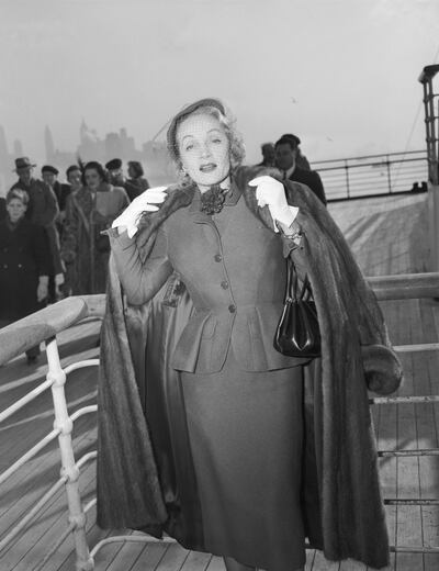 Marlene Dietrich arrives in New York City, 1950, onboard the Queen Elizabeth - her Christian Dior suit is on show at the V&A. Getty Images