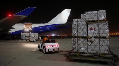 Workers load aid to be delivered to Rohingya refugees in Bangladesh onto an plane at a Dubai airport. Satish Kumar / Reuters