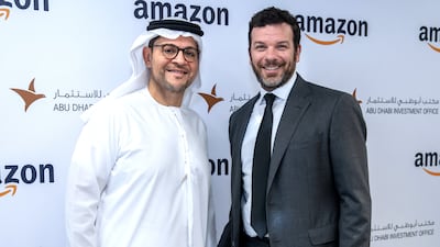 Mohammed Al Shorafa, chairman of the Abu Dhabi Department of Economic Development and head of Adio, left, and Russell Grandinetti of Amazon. Victor Besa / The National