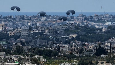 Parachutes drop supplies into the northern Gaza Strip as seen from southern Israel on Sunday, March 24, 2024. AP