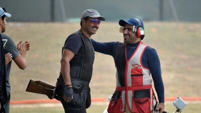 Fehaid Al Deehani, left, of Kuwait shown at Asian Olympic Qualifying in January with UAE's Khaled Al Kaabi. Ravi Choudhary / Hindustan Times / Getty Images