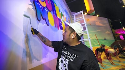 A graffiti artist at UrbaNation, which takes place at Formal Park, Corniche, from November 14