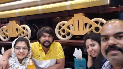 Mansour Thekkilparambil and his wife, left, with their friends Rijesh Kalangadan and Jeshi Kandamangalath, who were among those killed in the Deira fire that took the lives of 16 people. Photo: Mansour Thekkilparambil