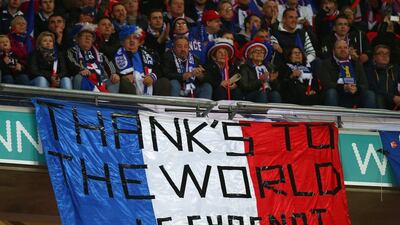 French supporters hold a banner to appreciate the support following the terror attack in Paris. Clive Rose / Getty Images