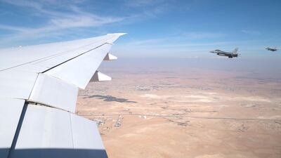 Fighter jets from the Jordanian Armed Forces fly along side the UAE Presidential Airplane, as a salute. Mohamed Al Hammadi / Ministry of Presidential Affairs