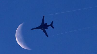 A US Air Force B1-B bomber plane flies above the Syrian town of Kobani on October 18 as seen from the Turkish border town of Suruc. AFP Photo