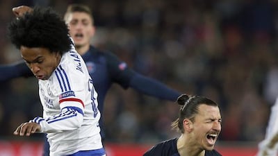 Zlatan Ibrahimovic (R) of Paris Saint Germain reacts next to Chelsea’s Willian (L) during the UEFA Champions League Round of 16 first leg soccer match between Paris Saint-Germain and Chelsea FC at the Parc des Princes Stadium in Paris, France, 16 February 2016. EPA/YOAN VALAT