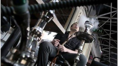 Muhib Attar smokes and uses free internet access every day at the Sawah Diner, a shisha bar in the Adams Morgan area of Washington.
