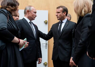 Russia's President Vladimir Putin, left, and French counterpart Emmanuel Macron are pushing for a new deal with Iran. AFP