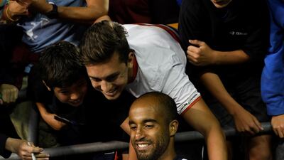 Tottenham's Lucas Moura with fans after the match. Reuters