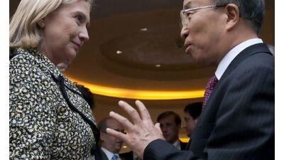 Chinese state councilor Dai Bingguo, right, speaks with the US secretary of state, Hillary Clinton, after meetings at Kylin Villa in the southern Chinese city of Shenzhen yesterday. Saul Loeb / AFP Photo / Pool