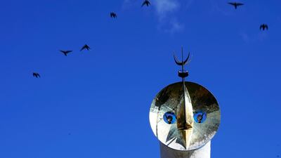 In this image birds fly past the Tower of the Sun at the Expo '70 Commemorative Park north of Osaka, Japan. AP