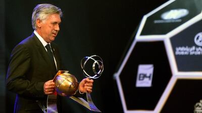 Real Madrid manager Carlo Ancelotti shown with the awards for best media attraction and best manager at the Globe Soccer Awards on Monday night in Dubai. Marwan Naamani / AFP