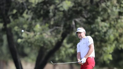 Ian Poulter plays a shot on the 10th hole on the fourth and final day of the Omega Dubai Desert Classic. Chris Whiteoak / The National