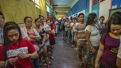 Filipinos fall in line to vote in Manila. Getty Images