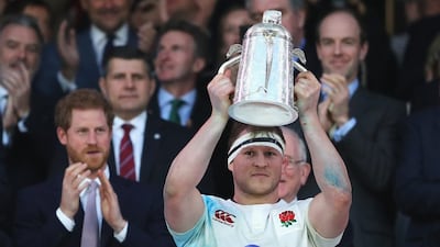 England's Dylan Hartley lifts the the Calcutta Cup after defeating Scotland at Twickenham on March 11, 2017 in London. Getty