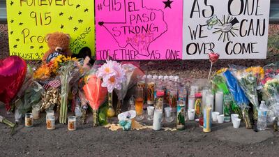 Flowers and signs are seen at a makeshift memorial after the shooting that left 22 people dead at the Cielo Vista Mall WalMart in El Paso, Texas, on August 5, 2019. AFP / Mark RALSTON