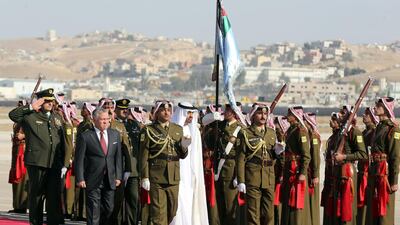 Sheikh Mohamed bin Zayed and King Abdullah II review an honour guard, at Queen Alia Airport in the Jordanian capital of Amman. Khalil Mazraawi / AFP