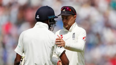 England captain Joe Root, right, shakes the hand of India all-rounder Hardik Pandya after the game. Reuters