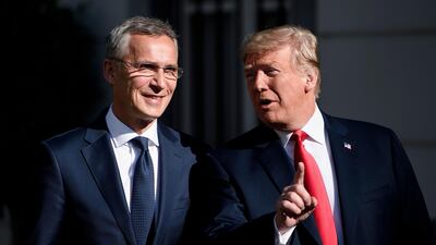 Nato Secretary General Jens Stoltenberg listens while US president Donald Trump makes a statement. AFP
