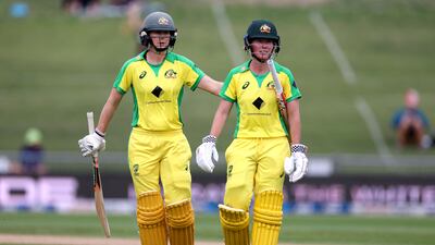 Australia's Beth Mooney walks from the field with teammate Ellyse Perry at the end of a cricket match against rivals New Zealand. AFP