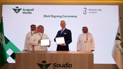 Ibrahim Koshy, chief executive of Saudia, and Tony Douglas, chief executive of Riyadh Air, during a signing ceremony at the Dubai Airshow. Photo: Saudia