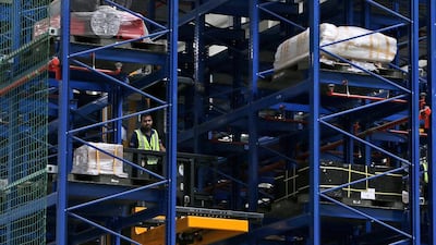 An employee of Emirates SkyCentral uploads goods at the new facility. Kamran Jebreili / AP Photo