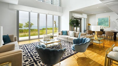 Natural light pours in through double-level windows. All photos courtesy LuxuryProperty.com