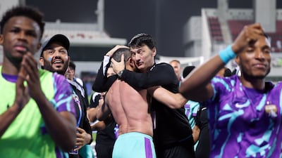 Manager Vladimir Ivic celebrates with Al Ain players after the match